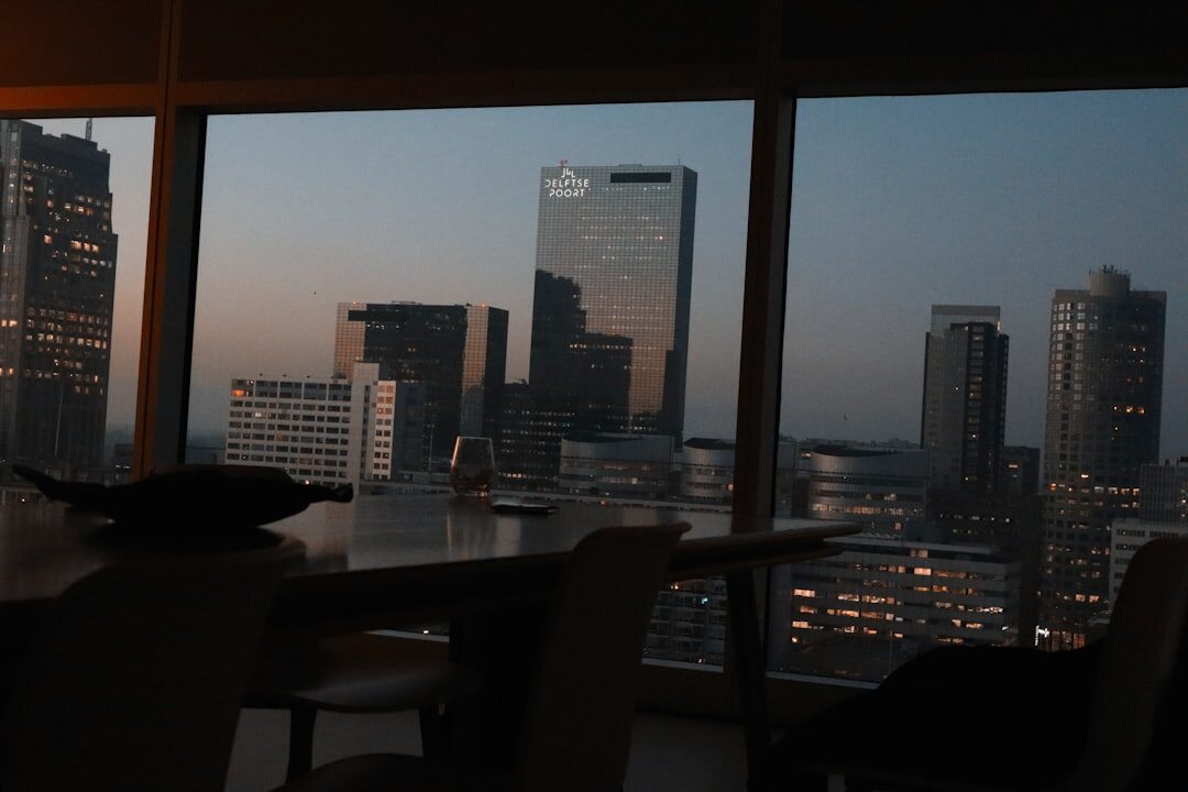 Elegant table setting with champagne glasses overlooking a city view