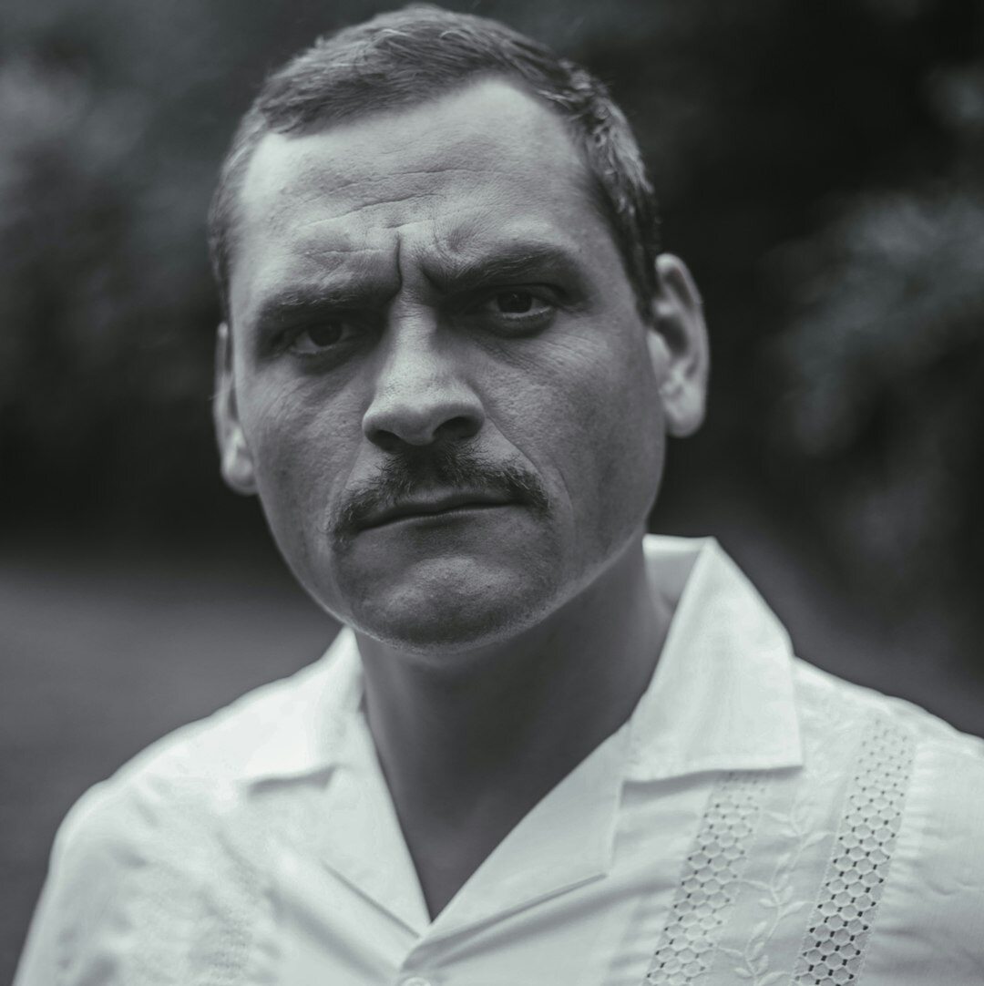 Studio portrait of a Uruguayan man journalist with short beard