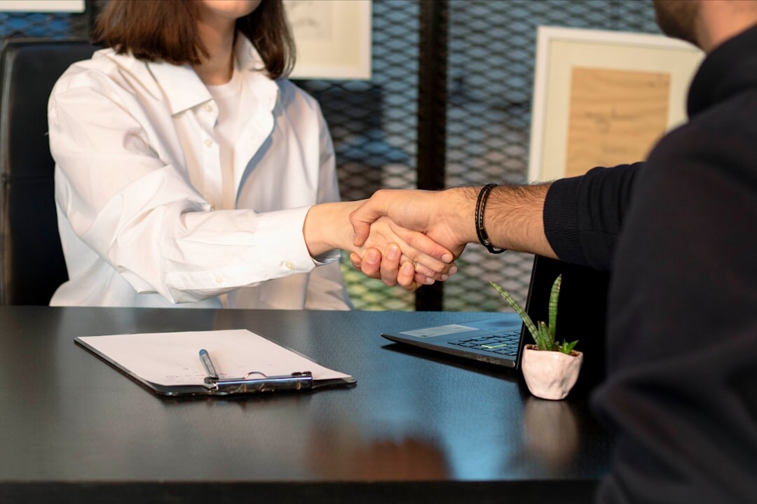 woman signing business deal
