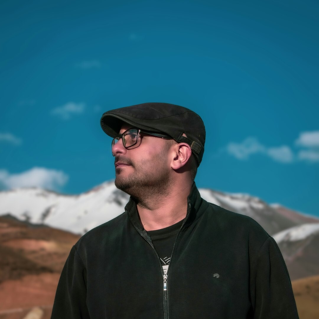 Studio portrait of a Uruguayan man content producer with glasses
